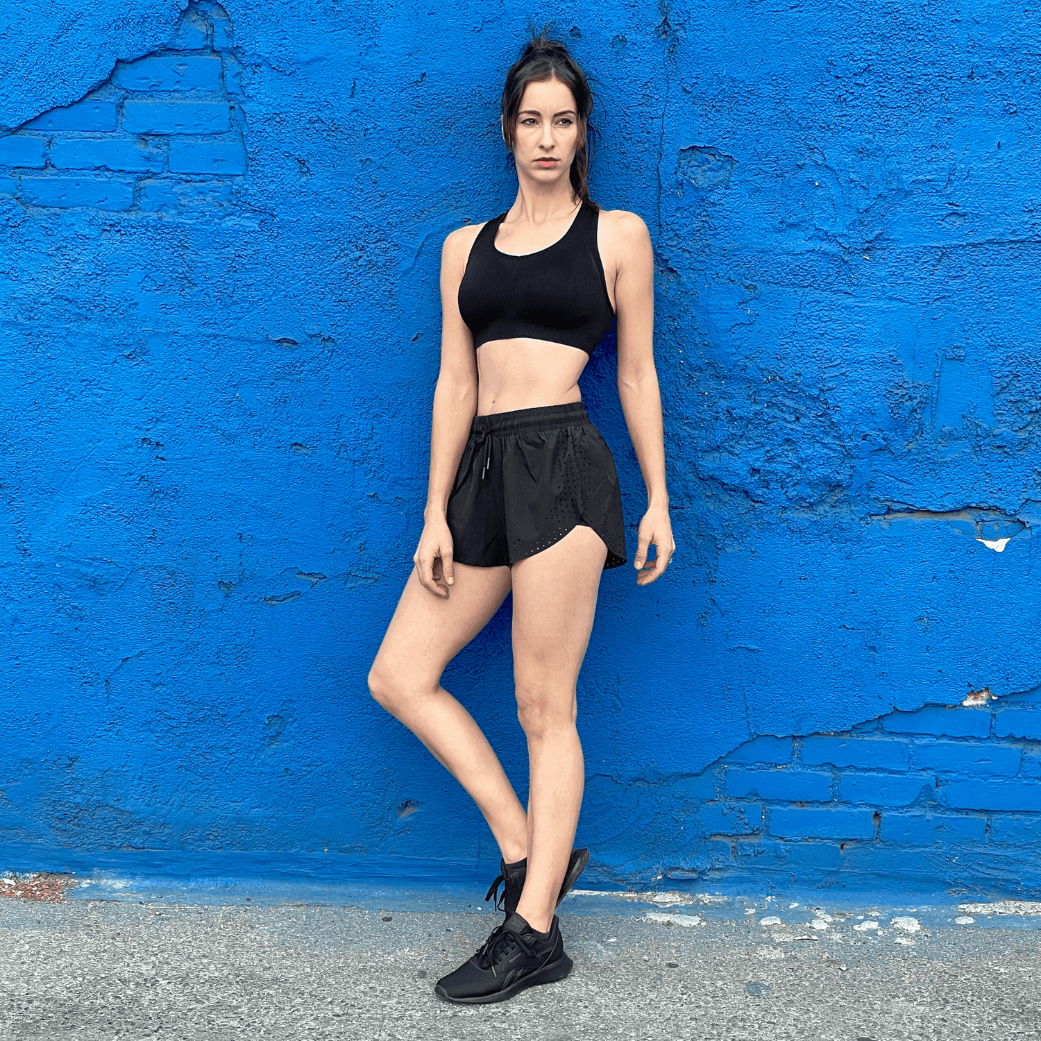 Black Lavender Arielle athletic shorts with built-in compression, shown in a close-up image highlighting the fabric and fit.