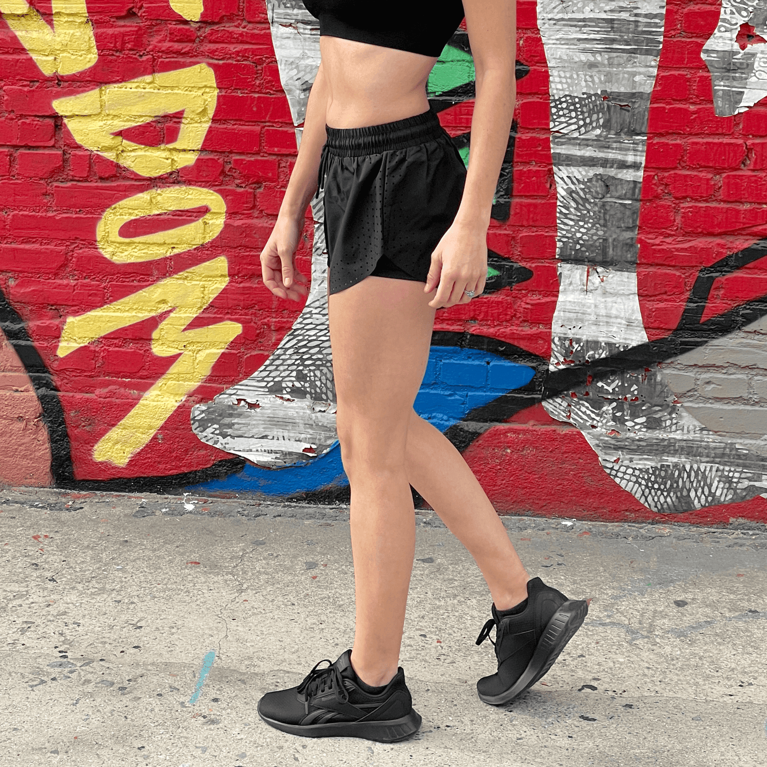 Black Lavender Arielle athletic shorts with built-in compression, featuring a sleek design and comfortable fit for activewear.