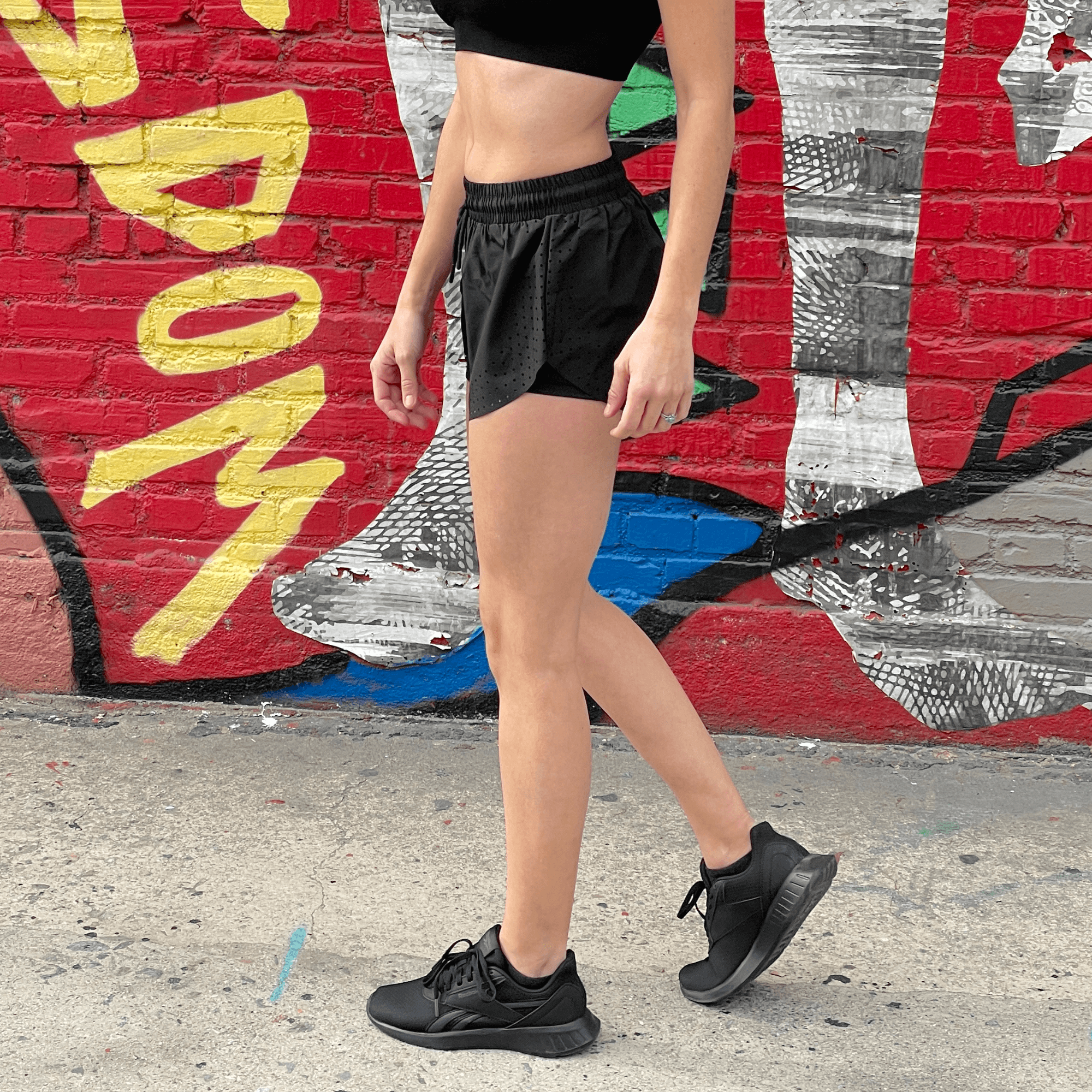 Black Lavender Arielle athletic shorts with built-in compression, featuring a sleek design and comfortable fit for activewear.