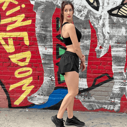 Black Lavender Arielle athletic shorts with built-in compression, featuring a sleek design and stretchy fabric for activewear workouts.