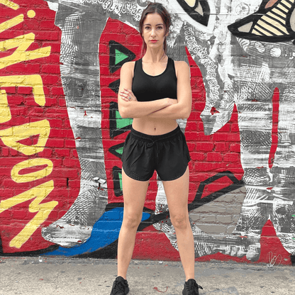 Black Lavender Arielle athletic shorts with built-in compression, featuring a sleek design and comfortable fit for activewear.
