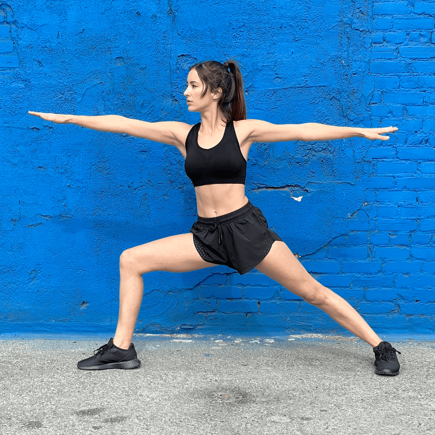 Black Lavender Arielle athletic shorts with built-in compression, featuring a sleek design and stretch fabric for activewear comfort.