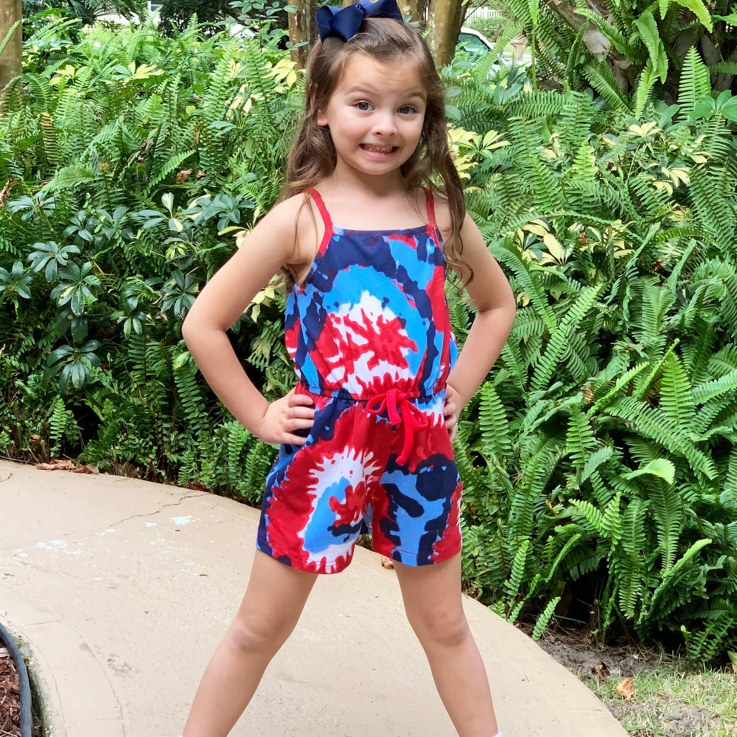 Black Simba AnnLoren girls tie-dye 4th of July jumpsuit, summer romper with patriotic red, white, and blue design, perfect for kids.