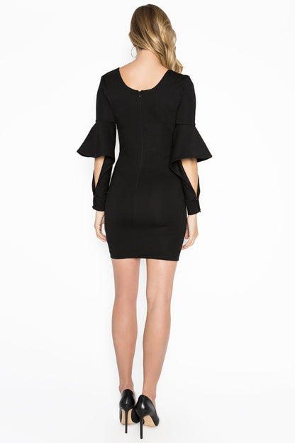 Black Jayla dress by Peach Dionysus, a mini body-conscious dress with novelty cuffed bell sleeves, shown from the back.