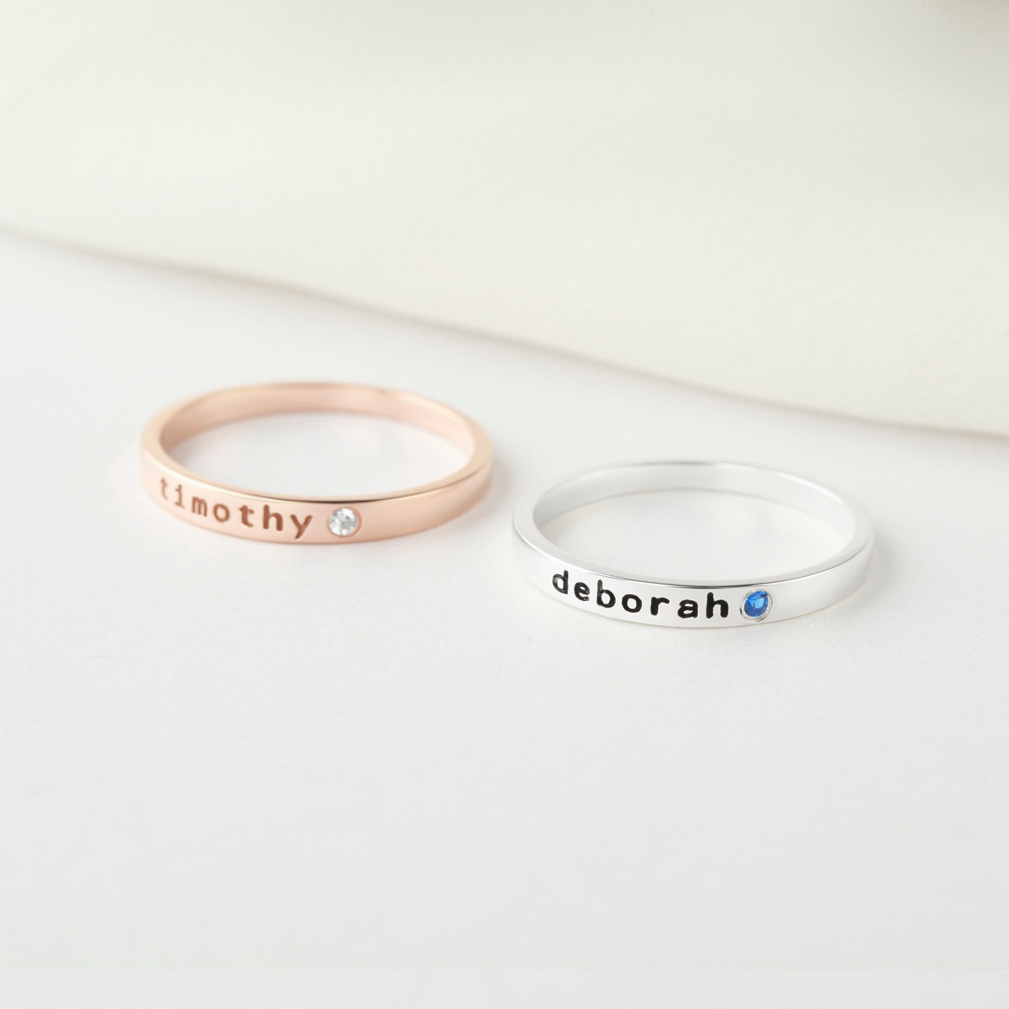 Personalized green millie stackable mom ring with engraved name and birthstone, showcasing a stylish jewelry piece.