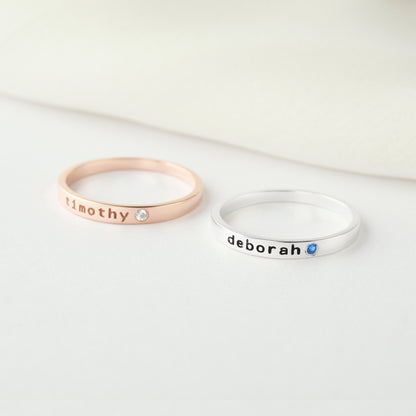 Personalized green millie stackable mom ring with engraved name and birthstone, showcasing a stylish jewelry piece.