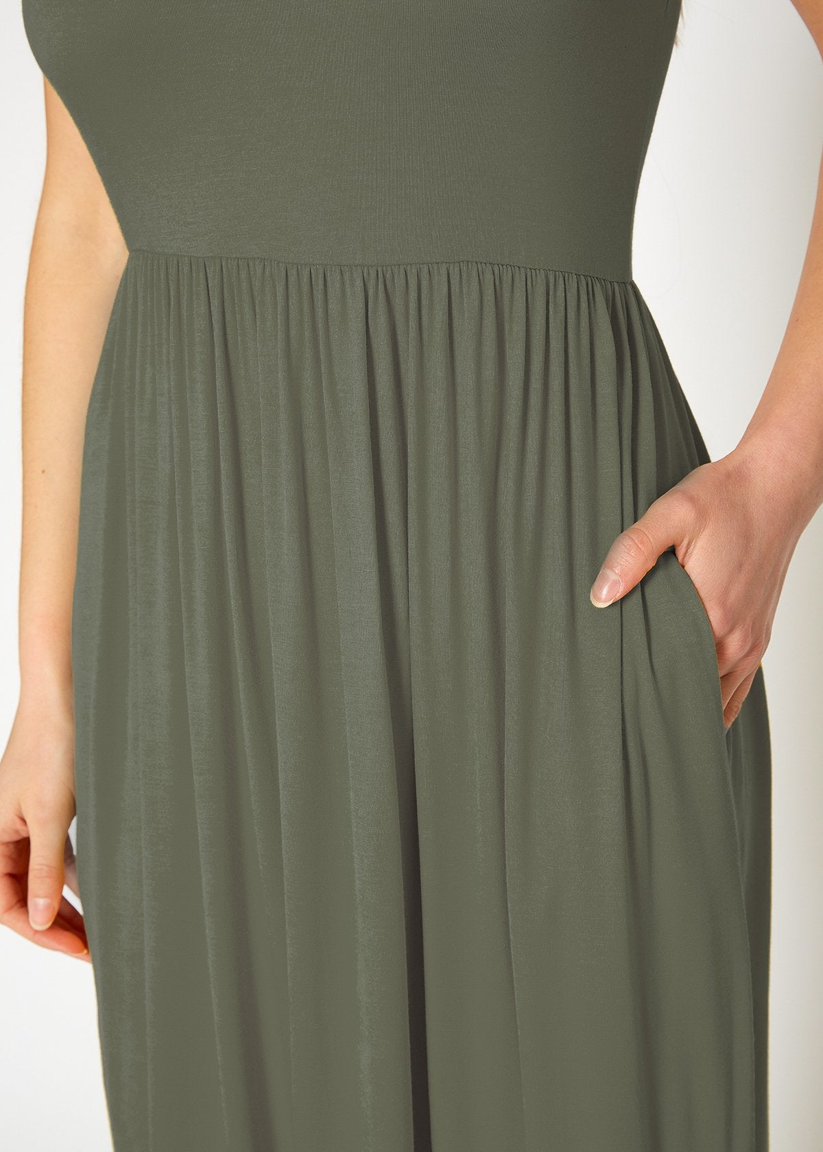 Women’s sleeveless pleated maxi dress by Lemon Hera in olive green, flowing fabric with a relaxed fit and elegant design.