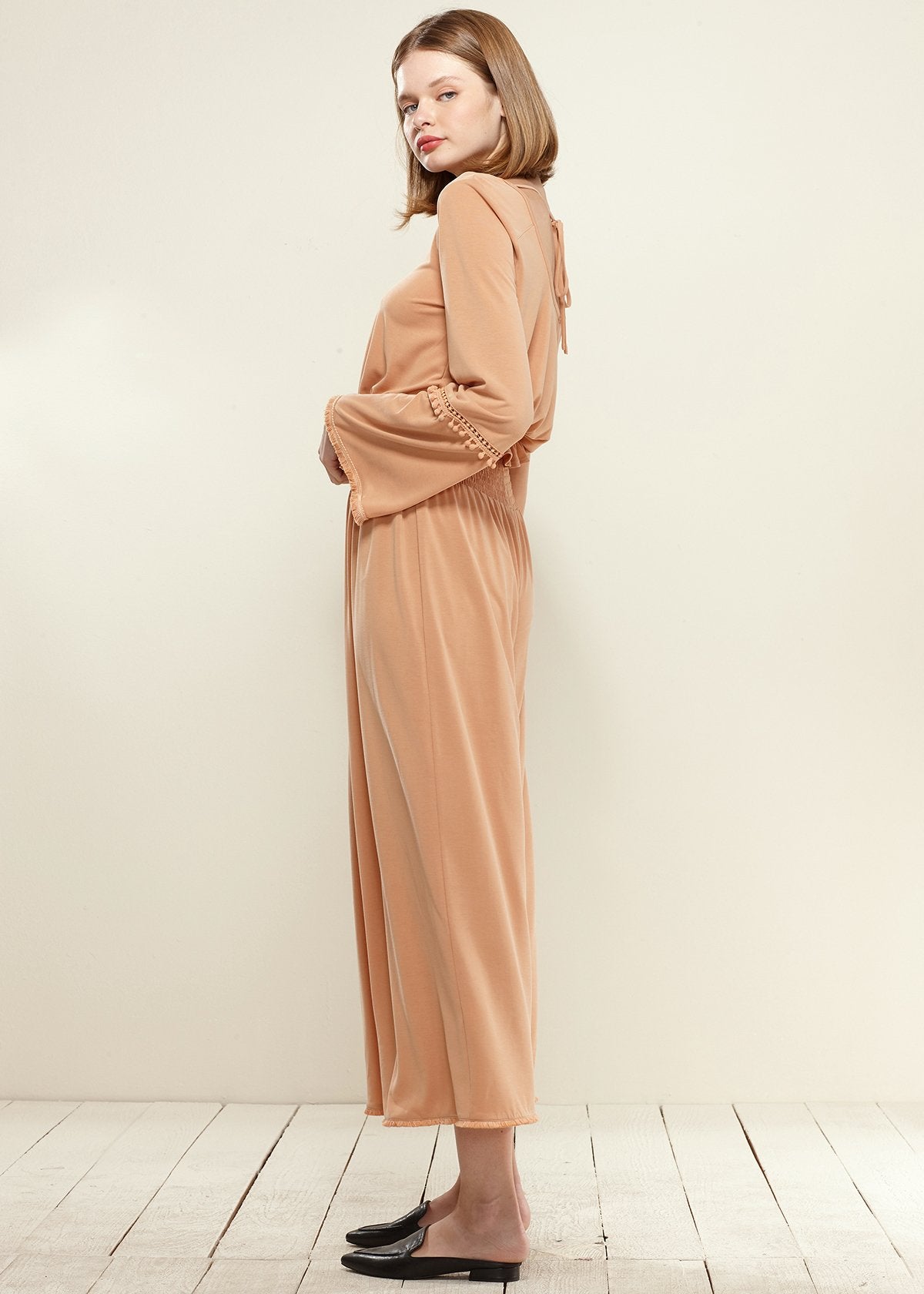 Lemon Hera smocked waist wide-leg palazzo pants in soft apricot color, flowing fabric and relaxed fit.