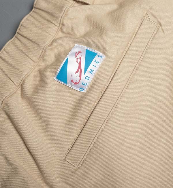 Ruby Tartarus cotton khaki shorts for swimwear, featuring a casual fit and lightweight fabric, shown on a model.