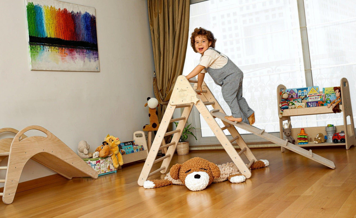 Red Oceanus climbing triangle and ladder ramp for kids, featuring a sturdy wooden furniture piece with colorful safety rails.