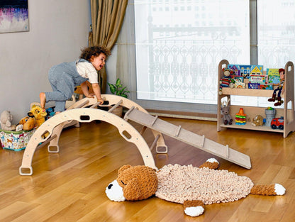 Wooden arch and rocker with ladder ramp for kids, made by Red Oceanus, showcasing a sturdy, natural wooden furniture piece for children.