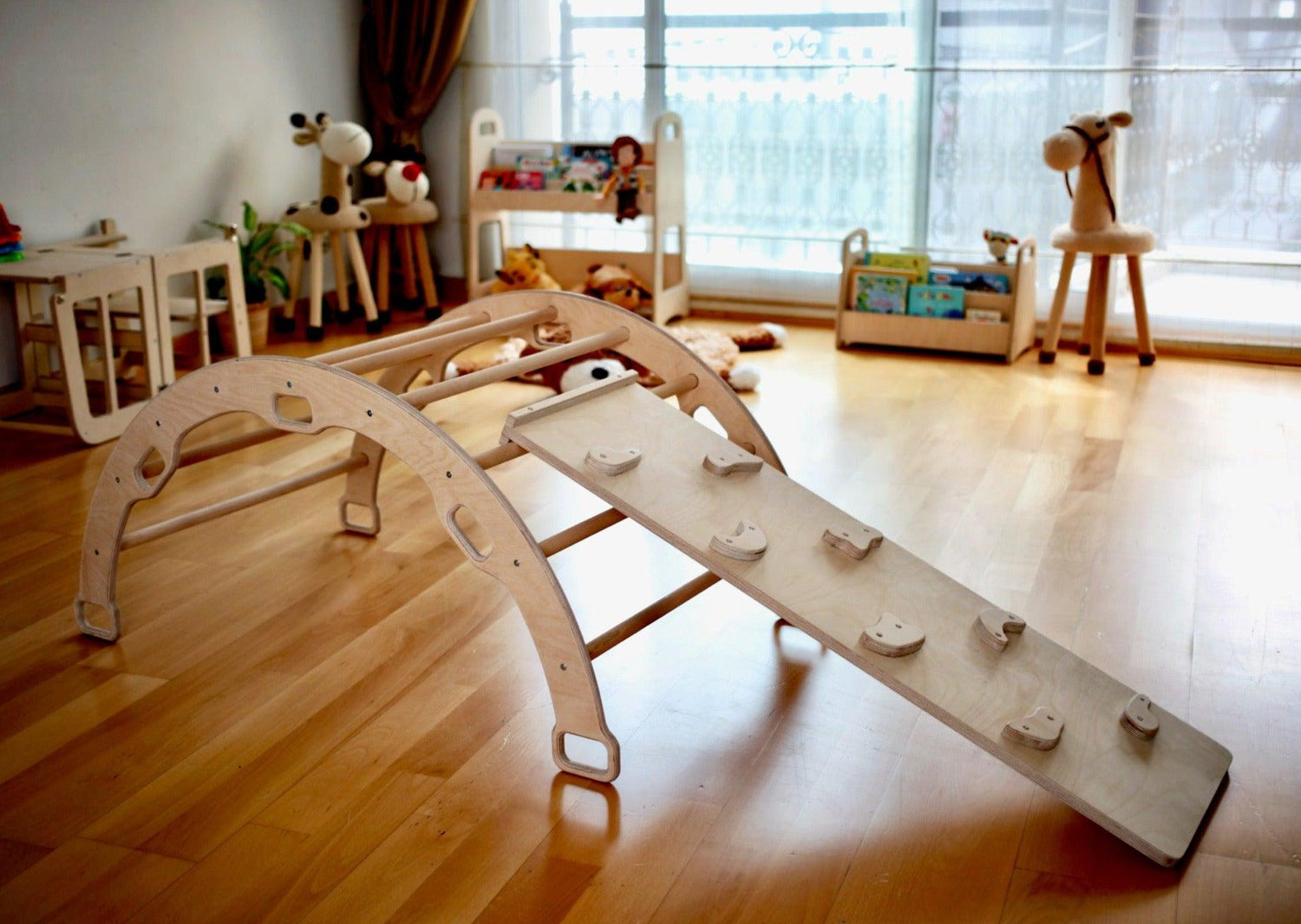 Wooden climbing arch rocker with ramps for kids, features smooth wood finish and colorful climbing surfaces, by Red Oceanus furniture.