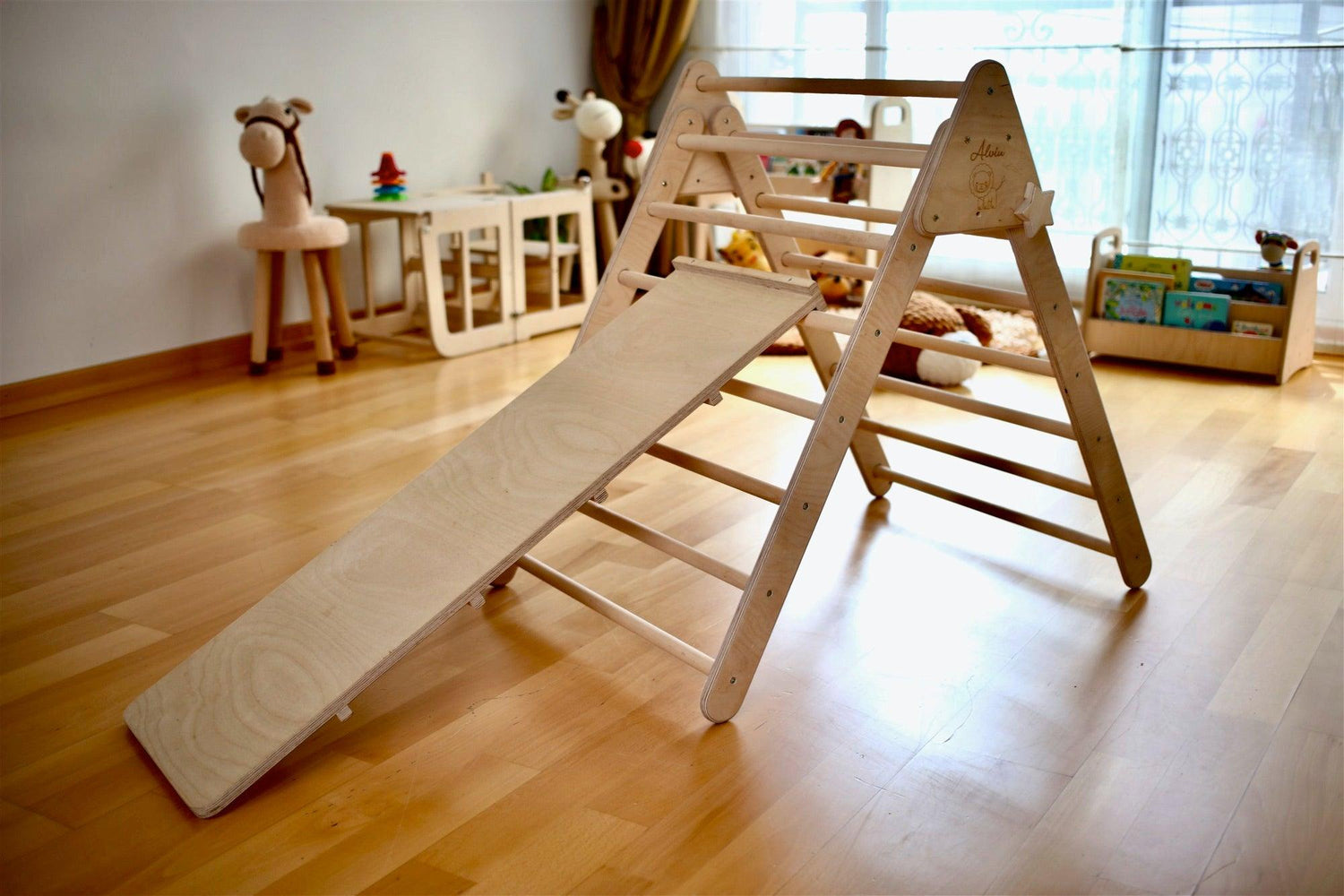 Red Oceanus foldable climbing triangle for kids, featuring sturdy wooden frame and vibrant fabric panels, suitable for indoor play.