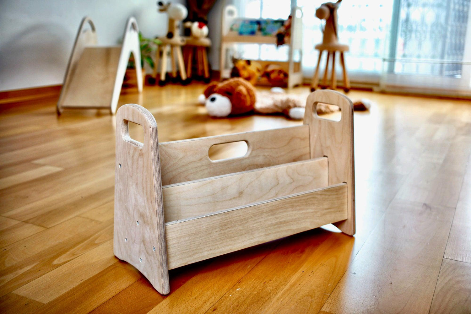 Small wooden bookshelf by Red Oceanus, featuring multiple shelves and a compact design for storing books and decorative items.