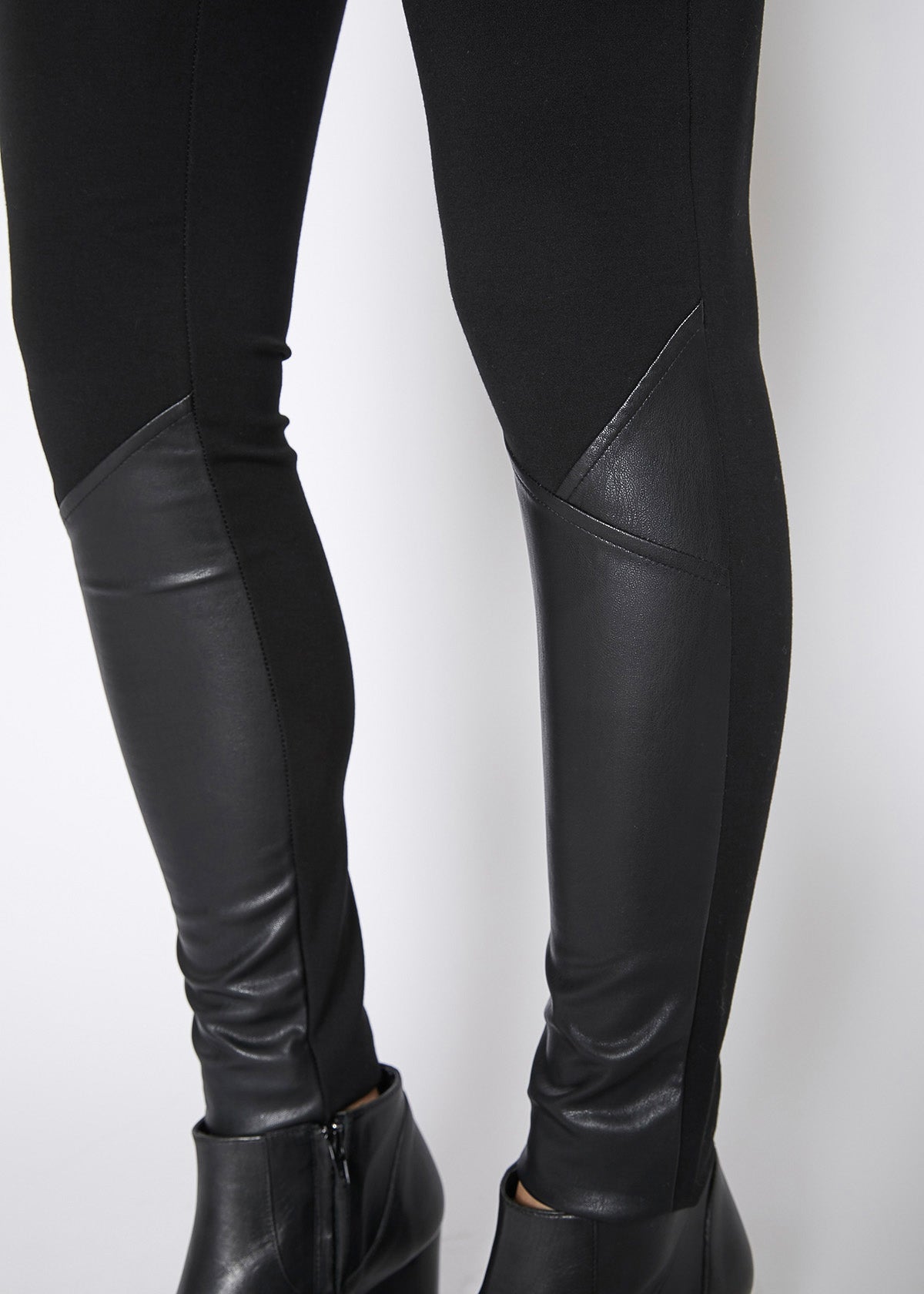 Black leather contrast skinny pants by Lemon Hera, showcasing a fitted style with sleek leather material and stylish design.