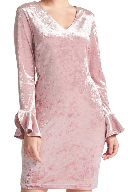 Close-up of Peach Dionysus Kara Dress featuring long sleeves, crushed velvet fabric, V-neckline, and bell sleeve details.