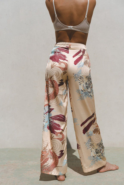Azure Thanatos Kayda Satin Wide Leg Pants in matching set, showcasing smooth satin fabric and wide-leg style on a model.