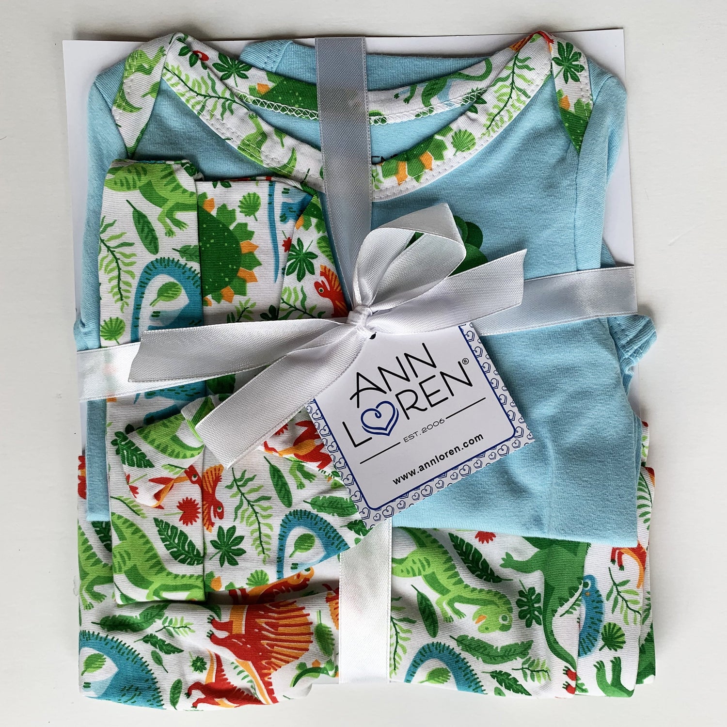 Black Simba baby boy dinosaur long sleeve onesie, pants, and cap set from AnnLoren Baby Layette, featuring fun dinosaur designs.