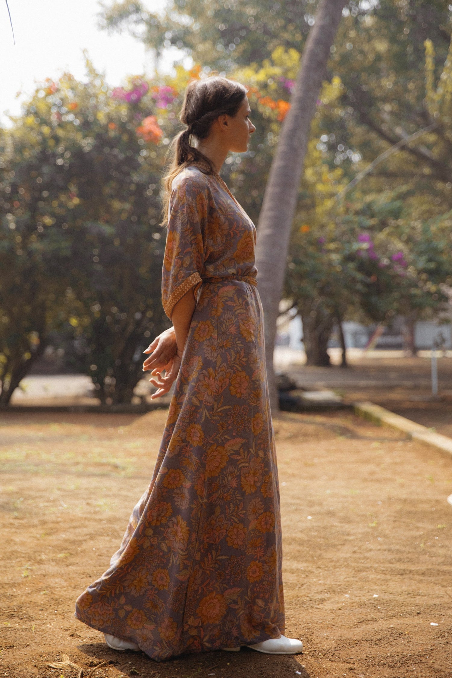 Violet Baobab Mia belted wrap dress styled as a versatile accessory in a lifestyle setting, featuring a flattering fit and elegant design.