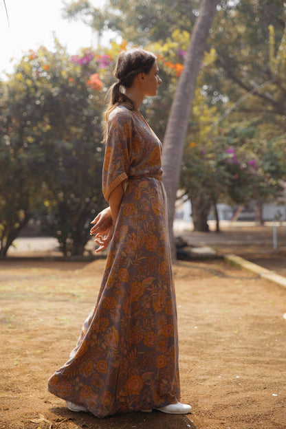 Violet Baobab Mia belted wrap dress styled as a versatile accessory in a lifestyle setting, featuring a flattering fit and elegant design.