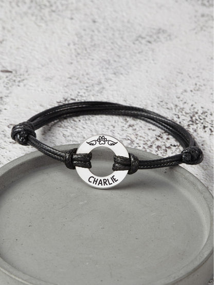 Leather bracelet with engraved pet name and dog paw charm, memorial gift for pet loss, by Green Millie.