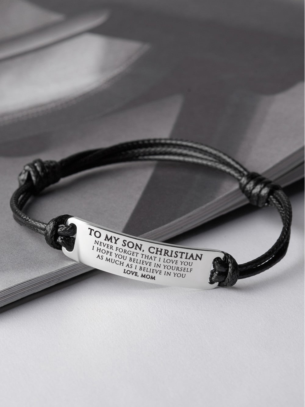Personalized Green Millie bracelet for son, a graduation gift from mom, featuring engraved customization and a sleek bracelet design.