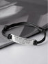 Personalized Green Millie bracelet for son, a graduation gift from mom, featuring engraved customization and a sleek bracelet design.