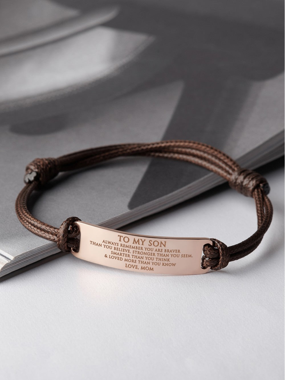 Personalized Green Millie bracelet for son with engraved message, ideal graduation gift from mom, showing the bracelet&