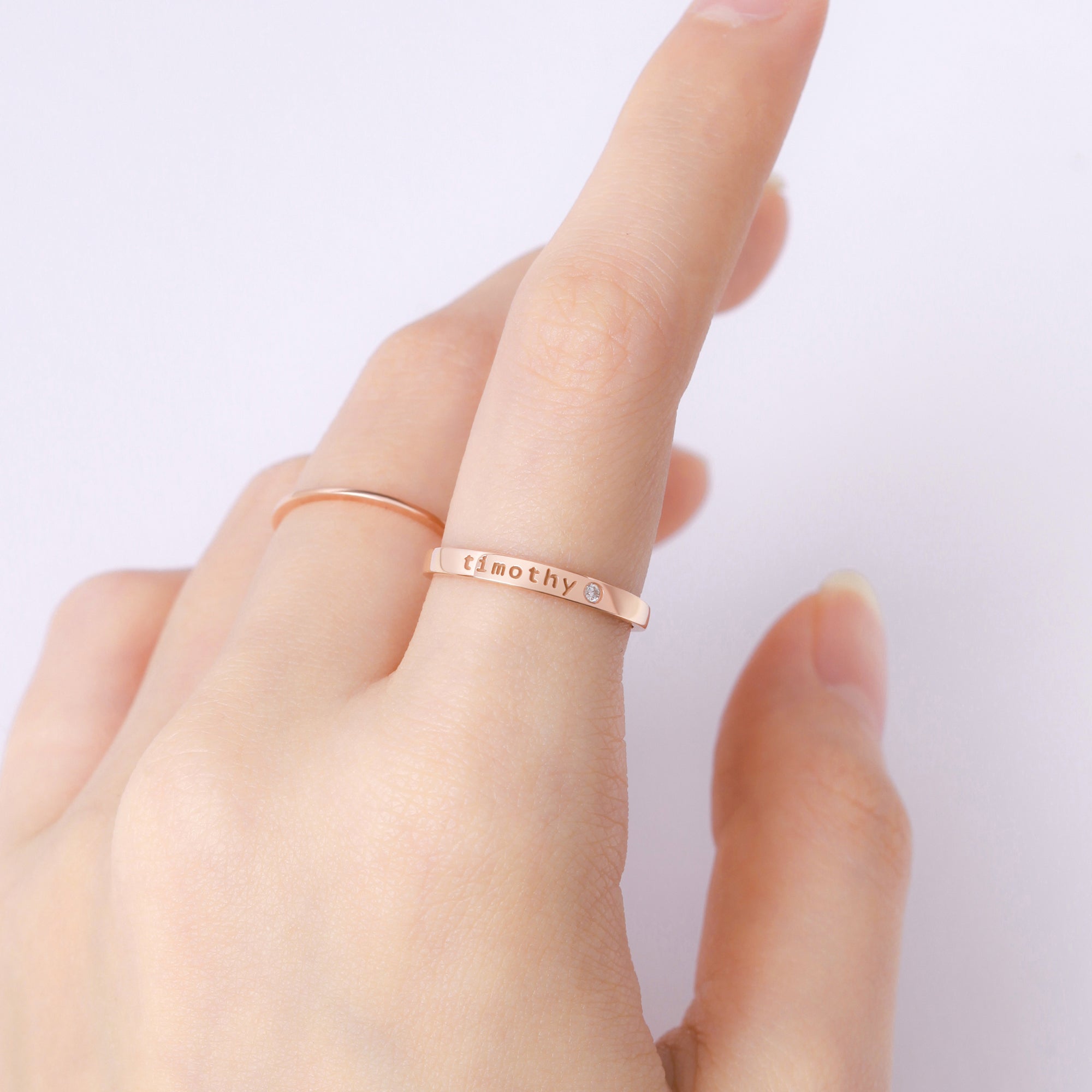 Personalized Green Millie name ring with embedded birthstone, stackable design, ideal for moms or personalized jewelry enthusiasts.