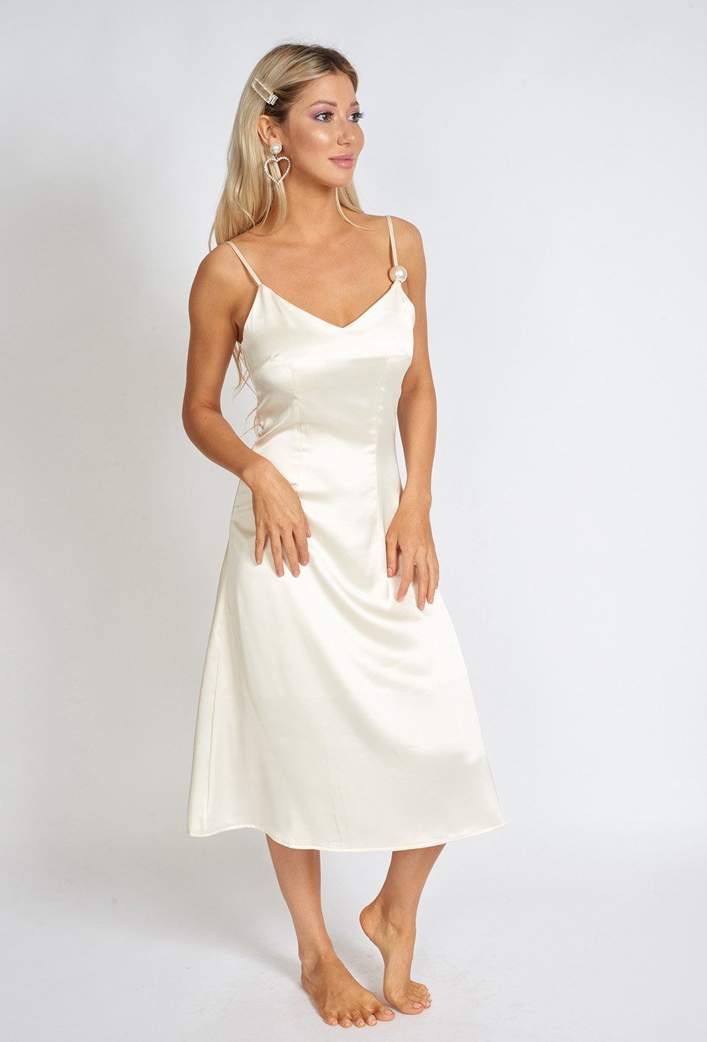 Azure Thanatos Léonie One Pearl Satin Slip Dress displayed on a mannequin, showcasing its elegant design and smooth satin fabric.