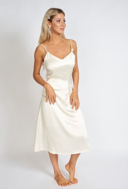 Azure Thanatos Léonie One Pearl Satin Slip Dress displayed on a mannequin, showcasing its elegant design and smooth satin fabric.