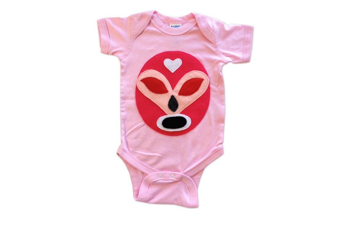 Pink Mexican wrestler onesie for babies featuring a luchador design, by Sky Blue Milo, perfect for adorable baby clothing.