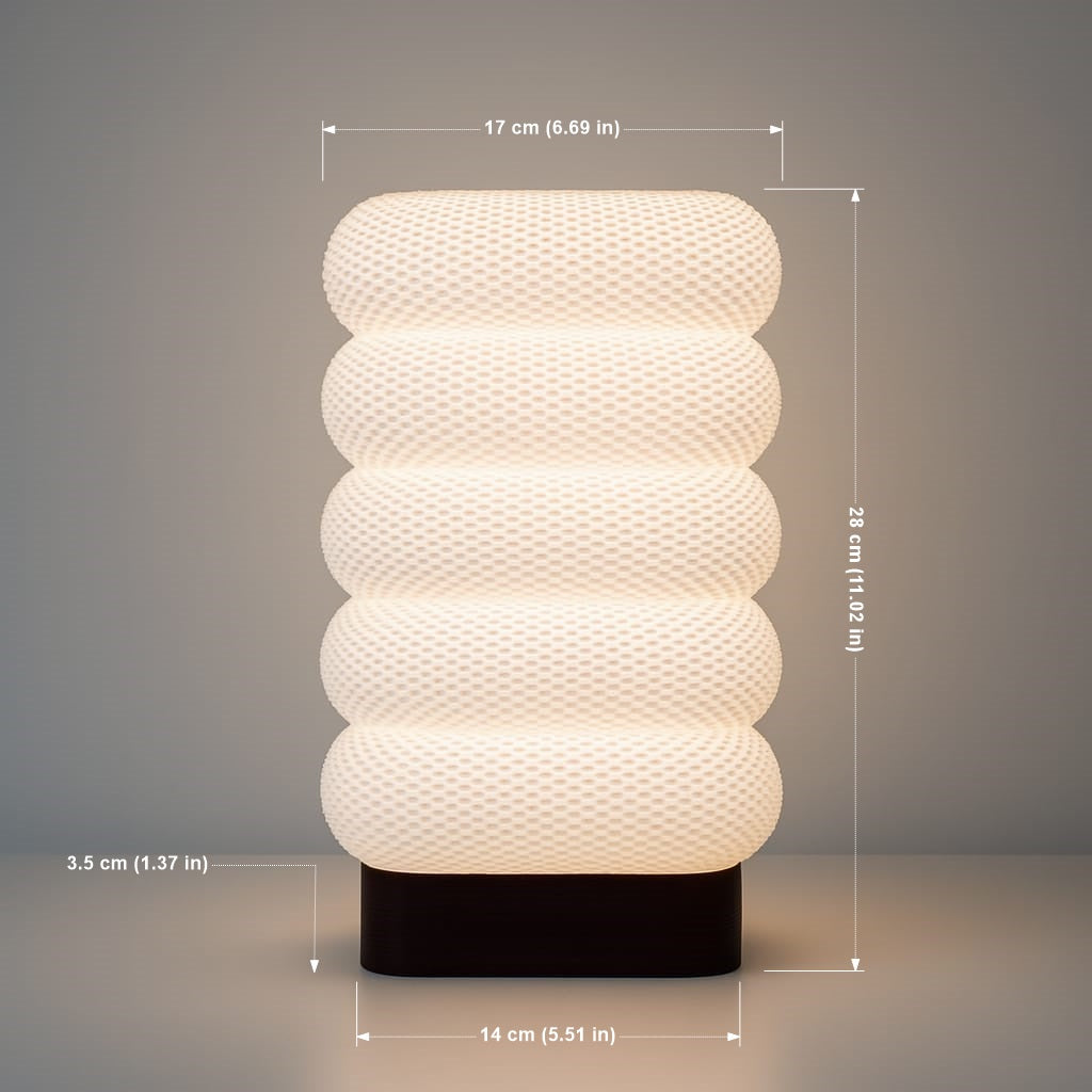Azure Pontus LumaCell table lamp with sleek modern design and soft ambient lighting for home or office decor.