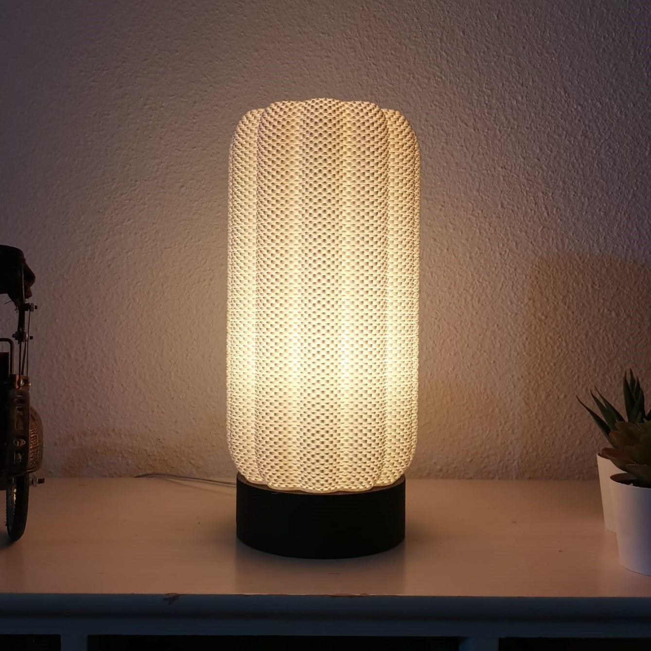 Azure Pontus Lumacore table lamp with sleek modern design, featuring a cylindrical white shade and metal base for stylish lighting.