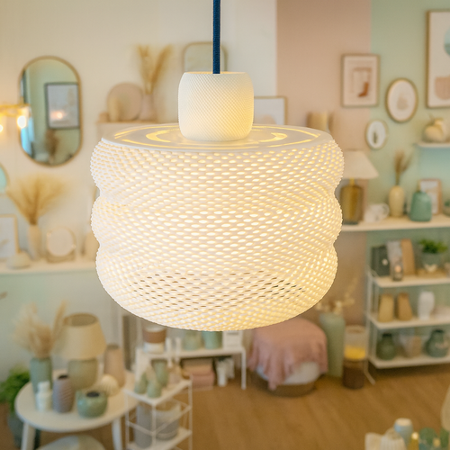 Azure Pontus luminous Hive pendant lamp hanging with a warm glow, showcasing its intricate geometric design and modern lighting style.