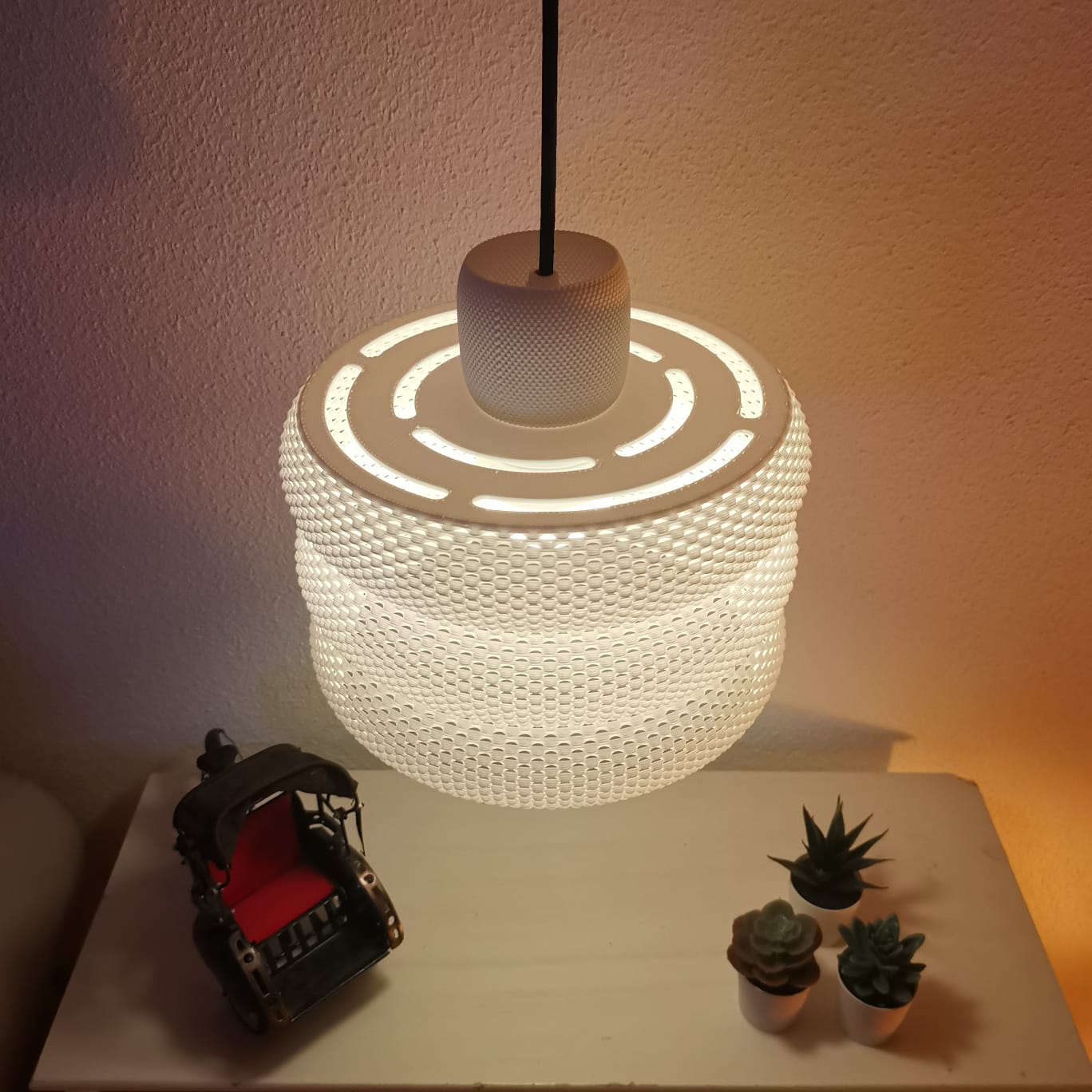 Azure Pontus Luminous Hive Pendant Lamp showcasing a modern, glowing geometric design hanging from a ceiling fixture.