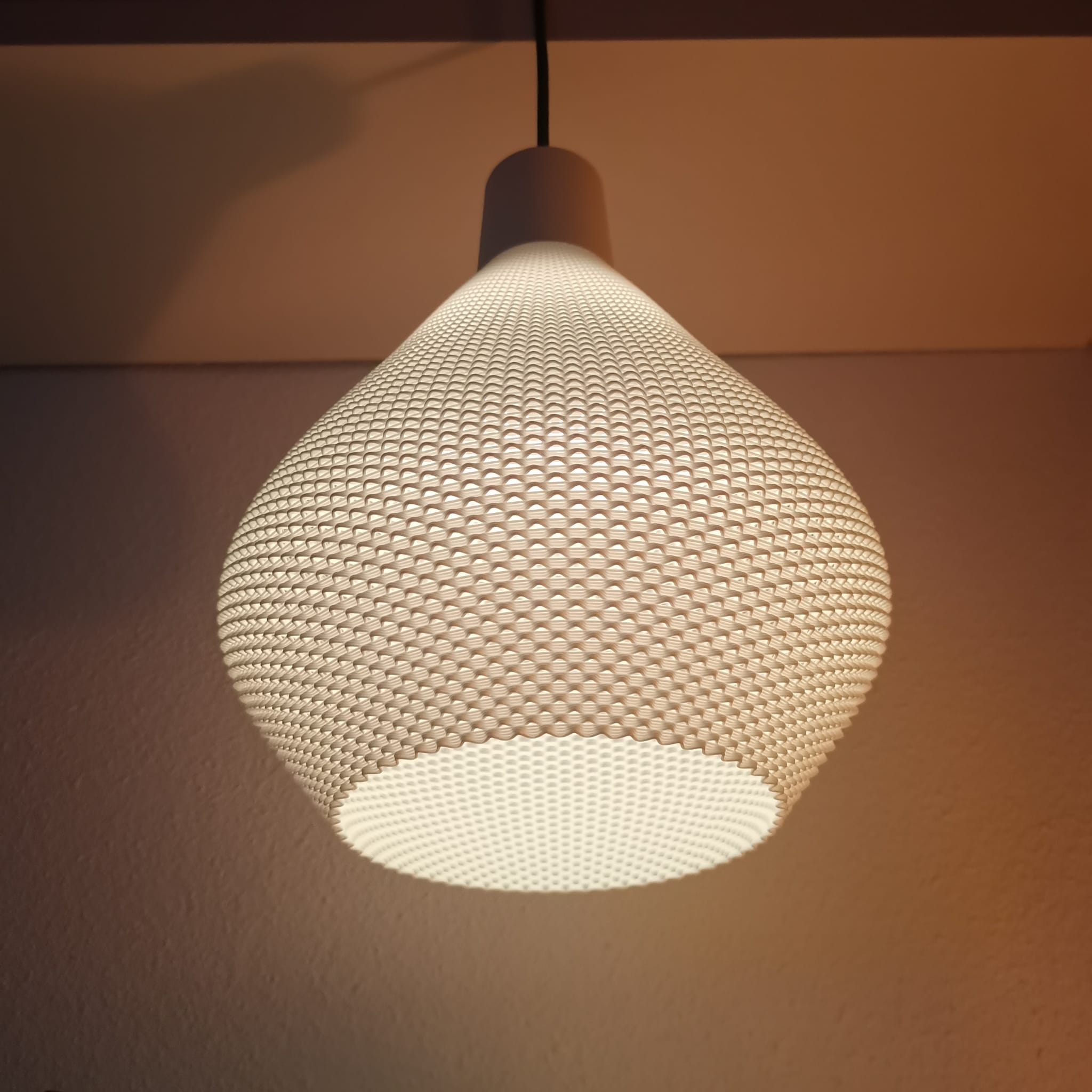 Azure Pontus Lumisera pendant lamp hanging from ceiling, modern lighting fixture with sleek design and warm illumination.
