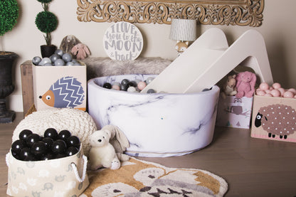 White wooden indoor slide for kids from Rose Metis, featuring a sleek, timeless design perfect for play and indoor use.