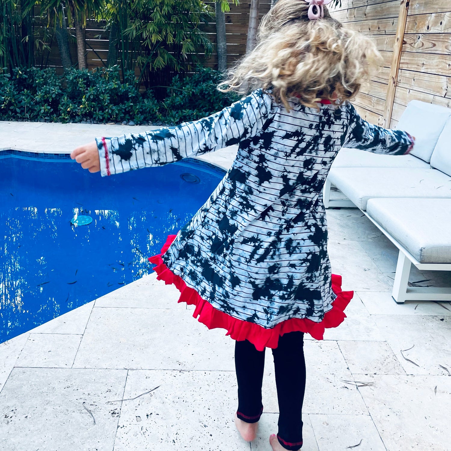 Back view of a girl wearing AnnLoren Black Simba Valentine&