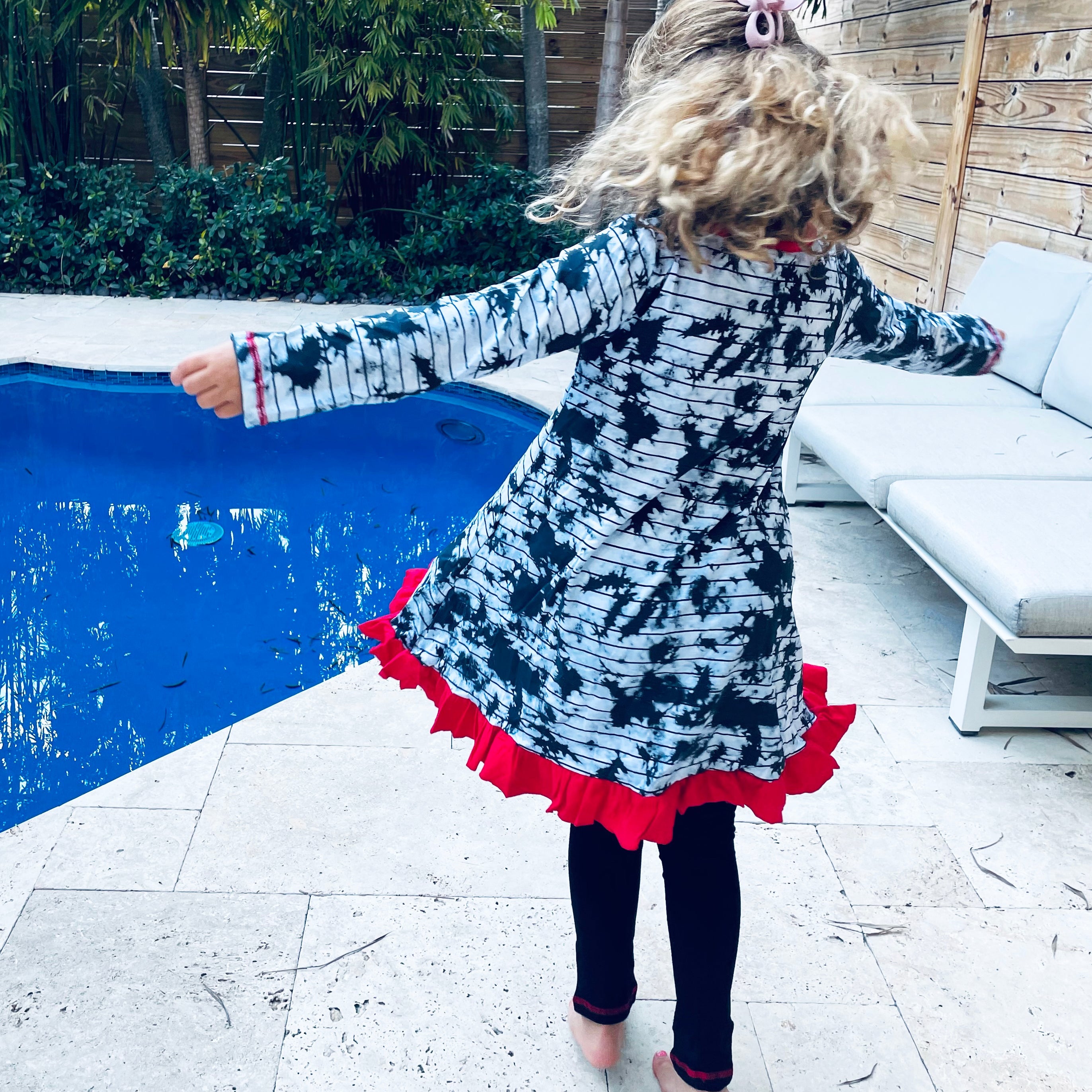 Back view of a girl wearing AnnLoren Black Simba Valentine&