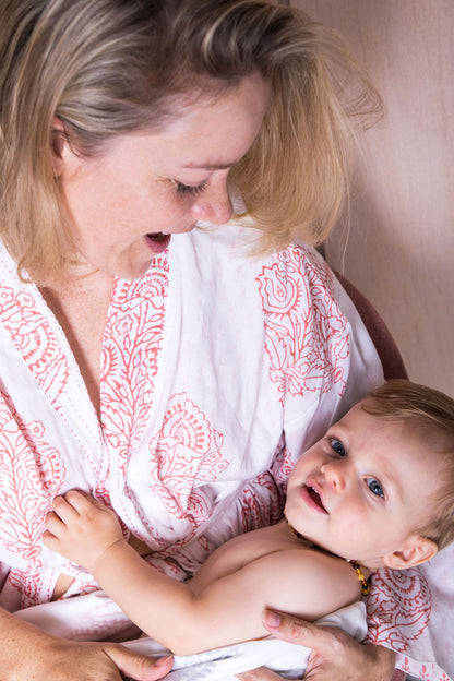 Pink block-printed robe from Ivory Meleager Pink City collection, featuring intricate patterns, perfect for gifts.