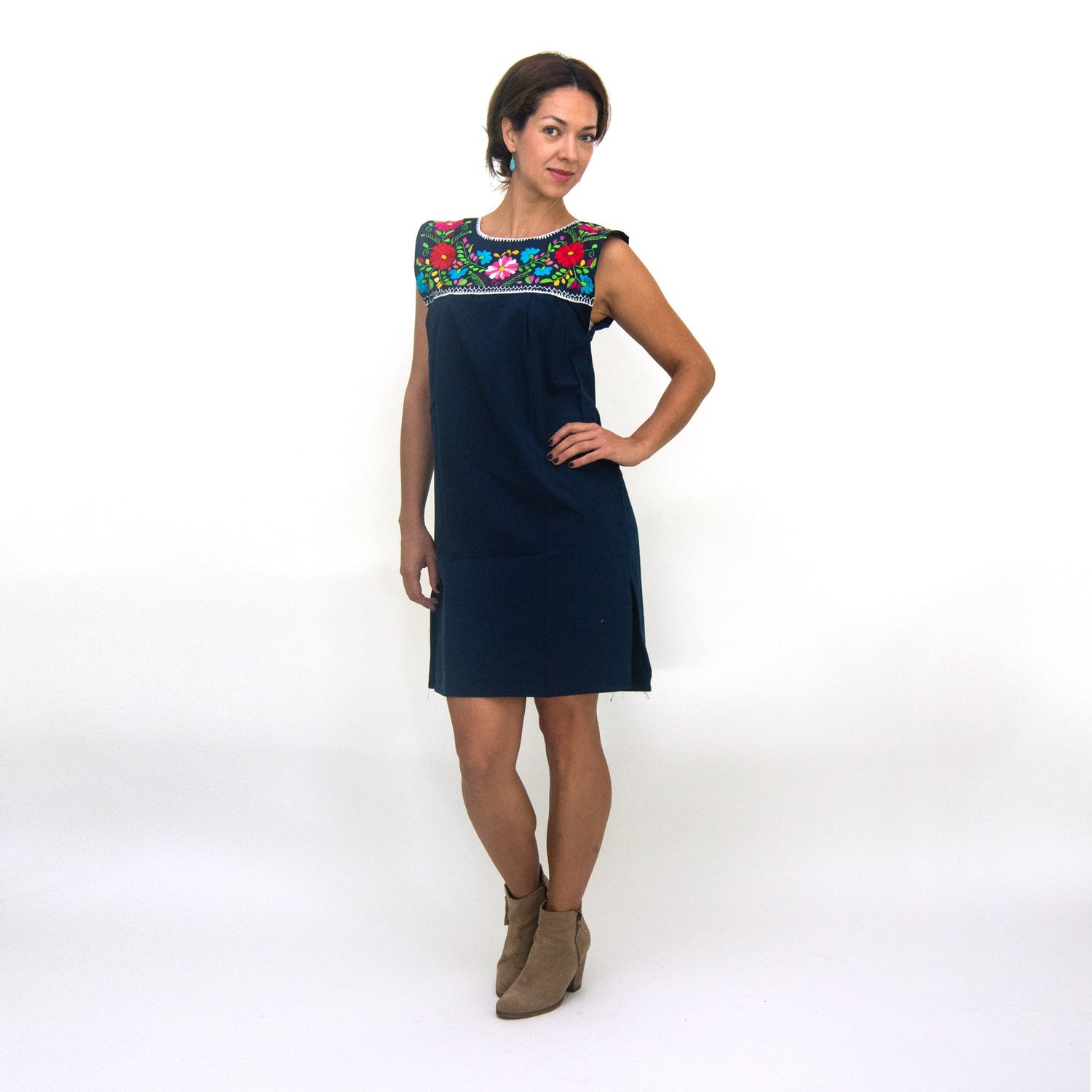 White hand-embroidered Mexican loose dress for women by Violet Athena, showcasing intricate embroidery and relaxed fit.
