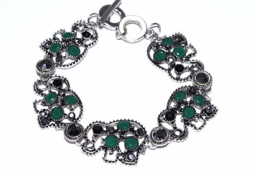 Silver Hestia Circle of Elephants bracelet featuring intricately detailed elephant charms on a silver chain.