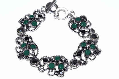 Silver Hestia Circle of Elephants bracelet featuring intricately detailed elephant charms on a silver chain.