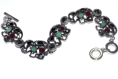 Silver Hestia Circle of Elephants bracelet featuring a charming design with elephants encircling the wrist in sterling silver.