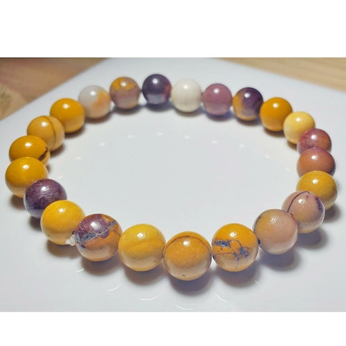 Australian Jasper Mookaite beaded elastic bracelet with polished round beads, designed by Silver Hestia for jewelry and watches.