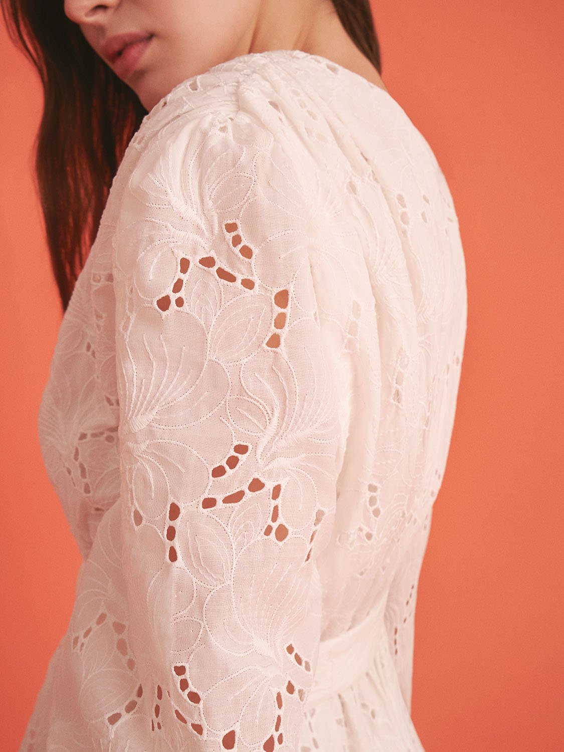 Embroidered bronze wrap mini dress for women, featuring detailed floral embroidery and a stylish fit by Bronze Aphrodite.