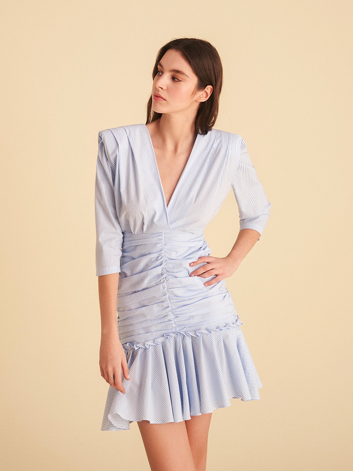 Bronze Aphrodite V-neck ruched mini dress for women, shown in a stylish fit and vibrant color.