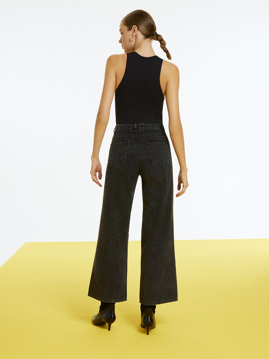 Bronze Aphrodite high-waisted ripped jeans for women, showing distressed denim style and fit details.