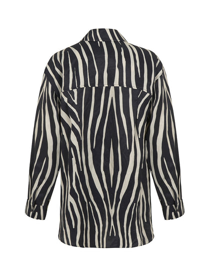 Women’s zebra print oversized linen shirt by Bronze Aphrodite, featuring relaxed fit and stylish zebra pattern.